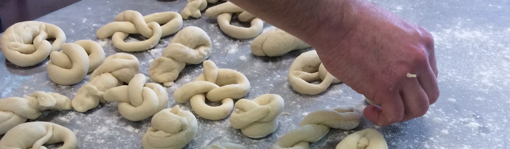 Forming pretzels- one of the bakery's specialties 
